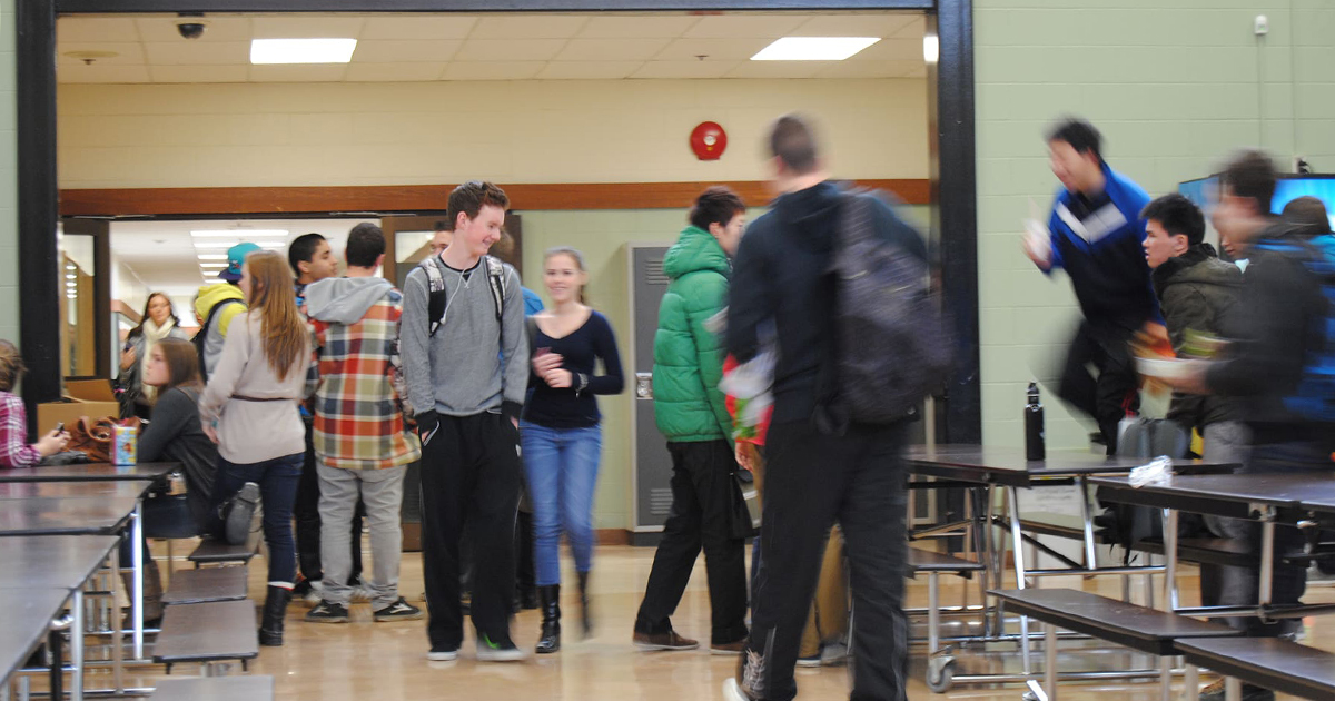 High school students walking through cafeteria
