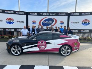 Chevrolet camaro wins nascar victory lane race.